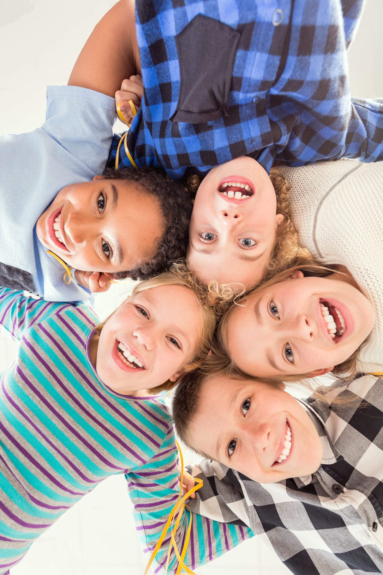 children touching their heads